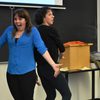 Actors doing an improv comedy sketch