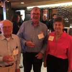Three people pose for a photo