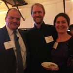 Three people pose for a photo