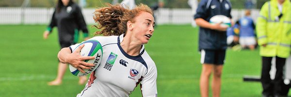 Ashley English running with a rugby ball