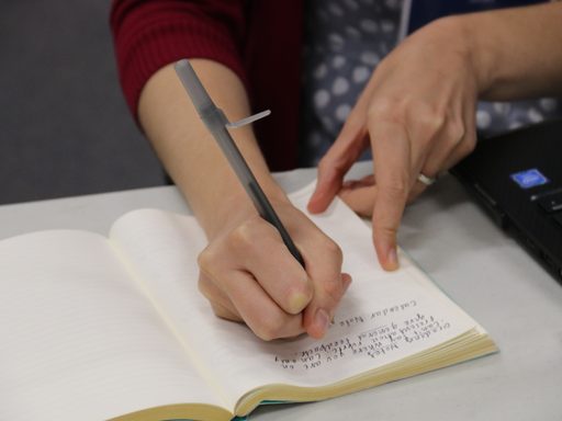 APSI participant taking notes