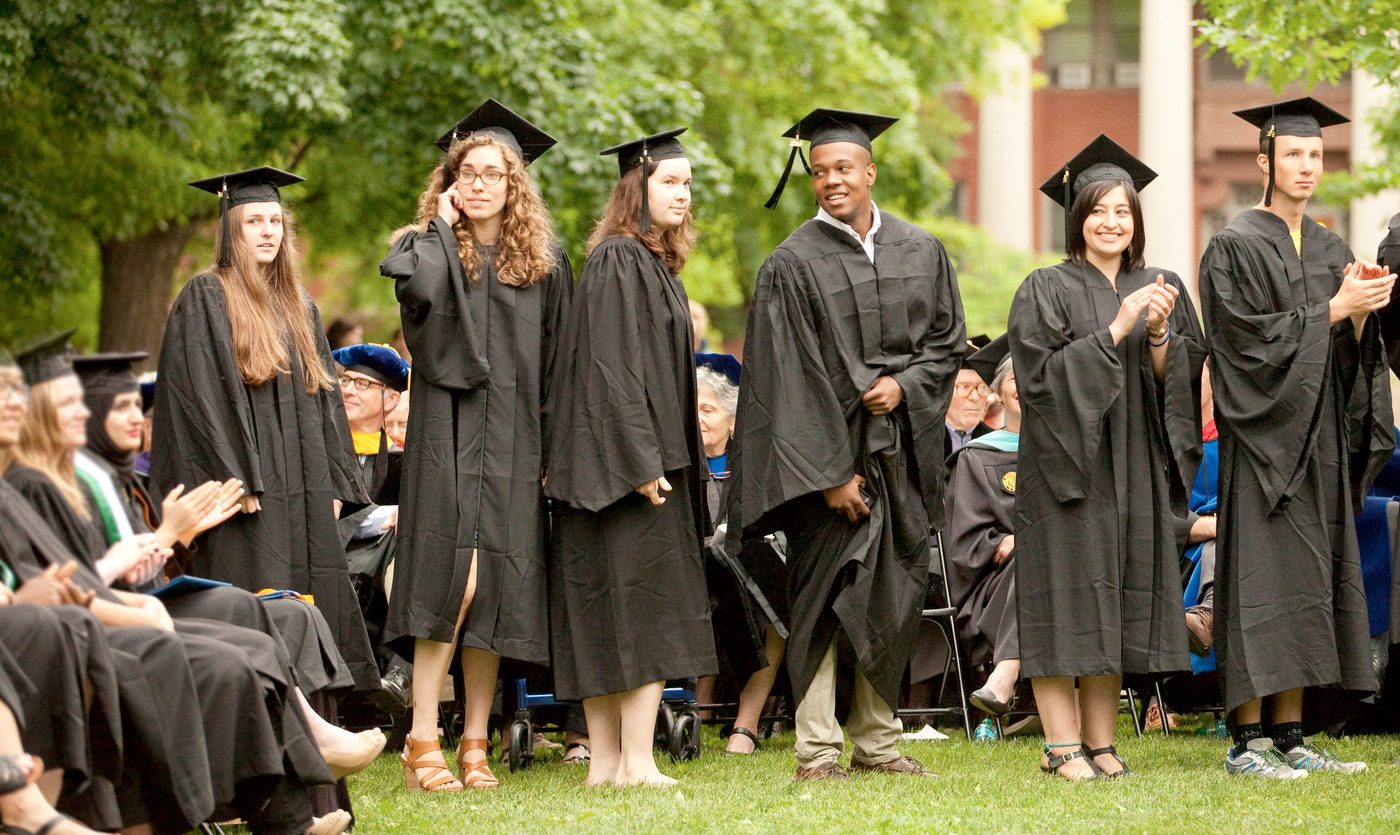 A line of students in graduation caps and gowns