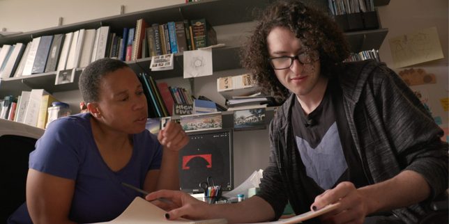 A professor and student in an office