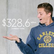 Photo illustration of a student with the campaign dollar amounts (current: $328.6 million, goal: $400 million) hovering above his hands
